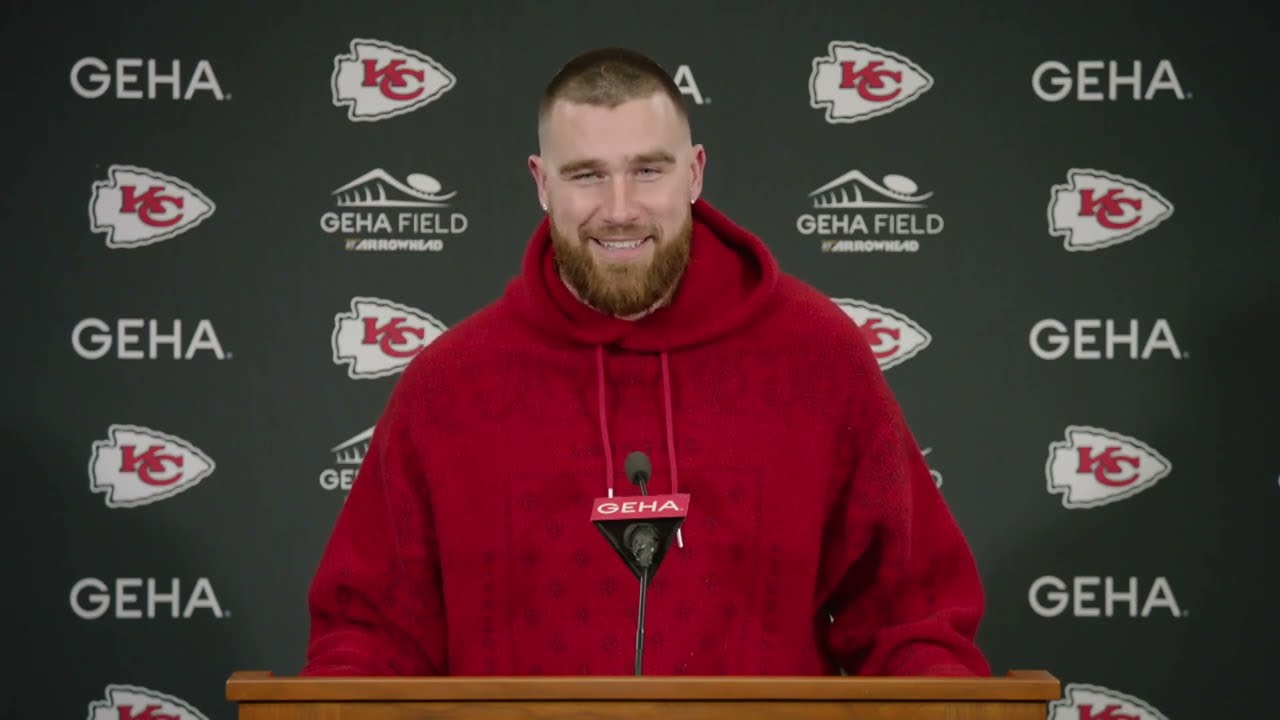 Travis Kelce smiles during a press event announcing his investment in Six Flags amusement parks.