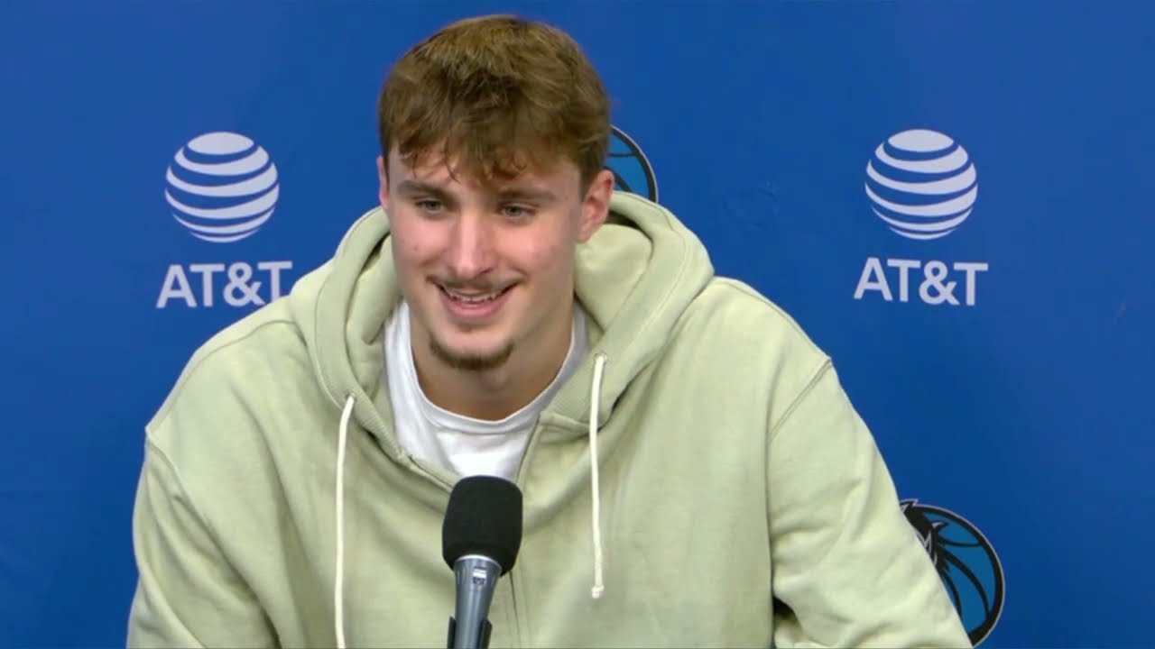 Cooper Flagg signing autographs for young fans near the court.