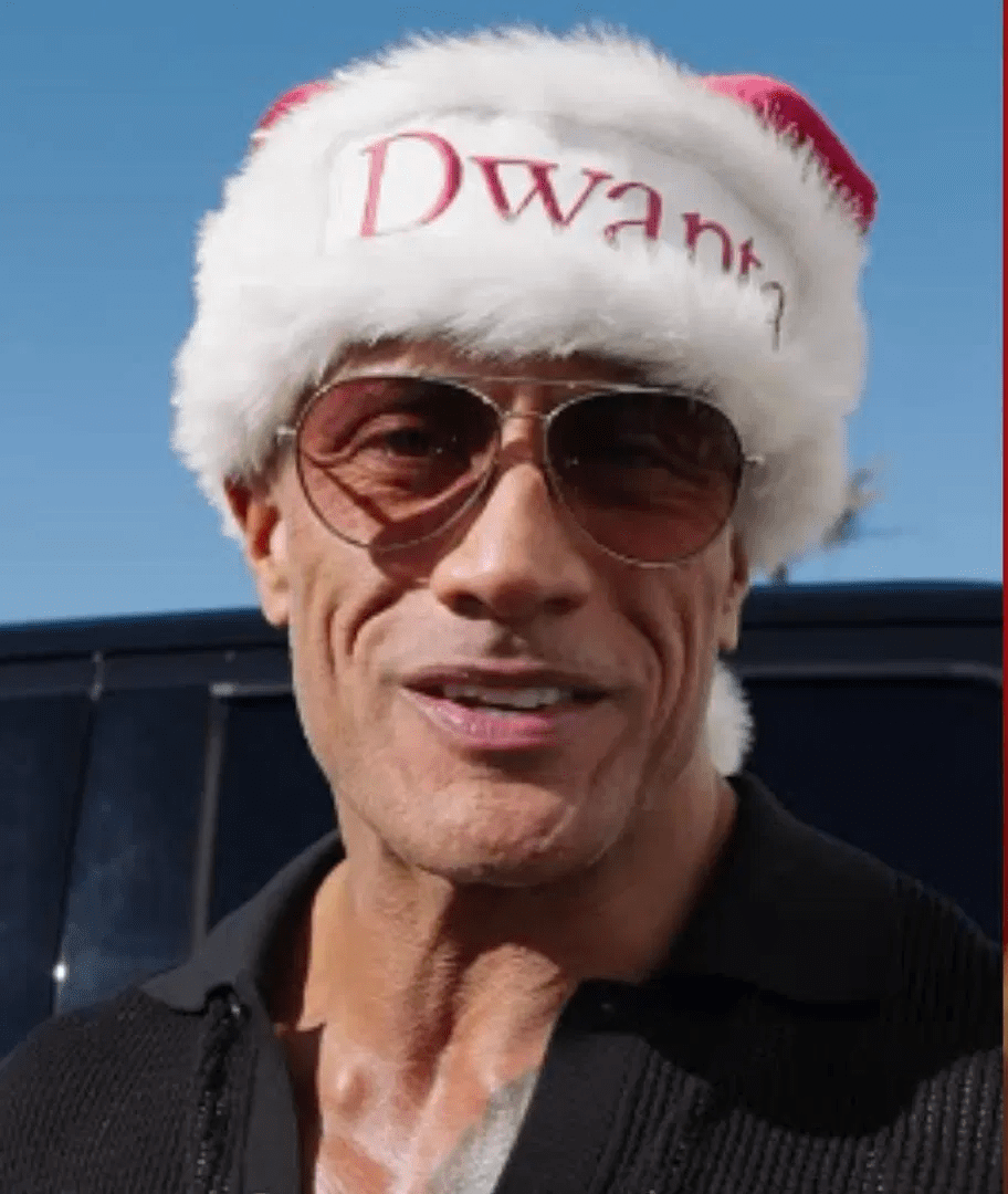 Dwayne “The Rock” Johnson surprising YMCA families during a holiday shopping spree at Walmart