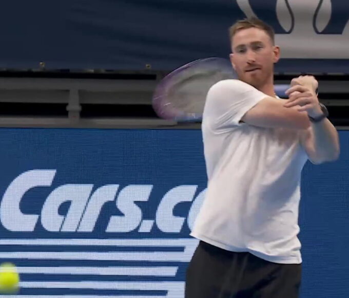 Gordon Hayward rallies forehands with Frances Tiafoe during the Charlotte Invitational tennis exhibition.