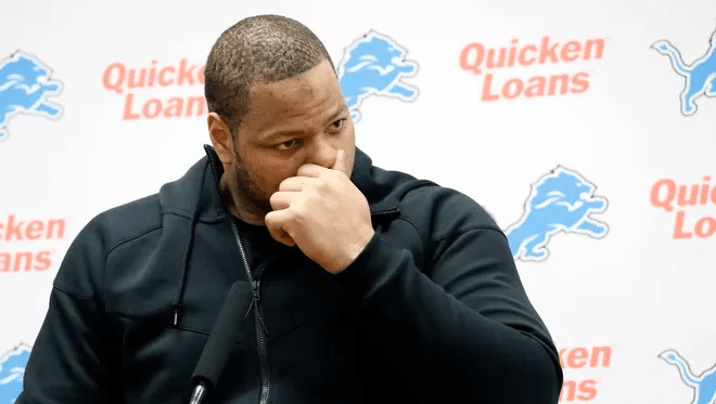 Ndamukong Suh not watching TV, seated and focused in a quiet room.
