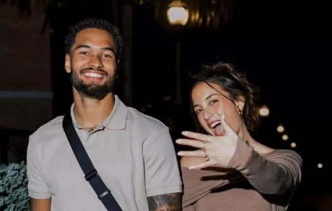 Emeka Egbuka on the field before a major game, focused and determined.