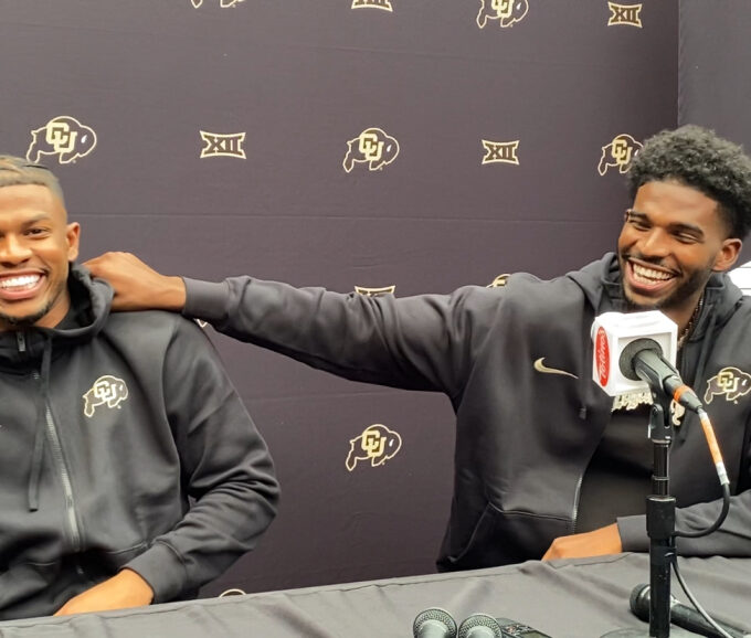 Shedeur and Shilo Sanders posing at the Amiri fashion show in Paris, embodying NFL energy in a luxury setting.