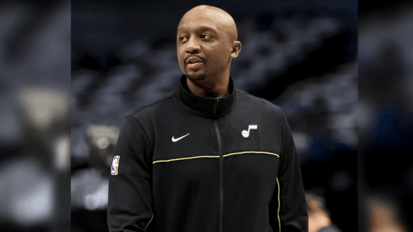 Jason Terry driving on a fast break during a basketball game, dribbling toward the basket with defenders nearby.