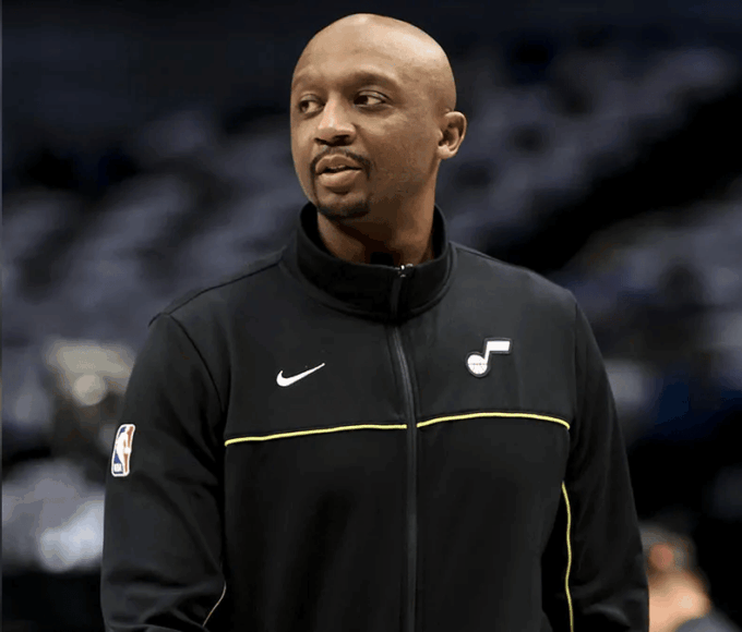 Jason Terry driving on a fast break during a basketball game, dribbling toward the basket with defenders nearby.
