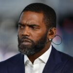 Randy Moss celebrating a catch with arms raised, illustrating the “You Got Moss’d” moment.