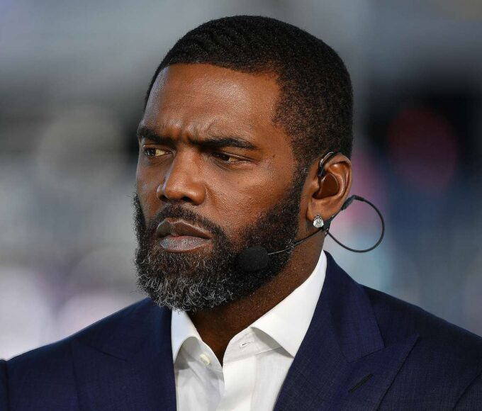 Randy Moss celebrating a catch with arms raised, illustrating the “You Got Moss’d” moment.