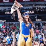 Nikki Cross, WWE wrestler, sprinting in her ring gear down a hallway while chasing a desk piled with history textbooks and a framed PhD diploma.